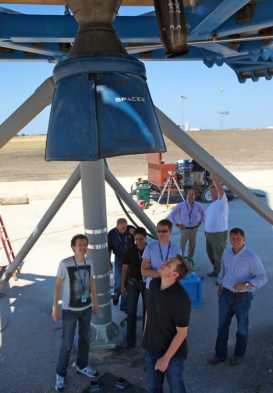 Elon Musk looking up into Grasshopper’s engine bay.
